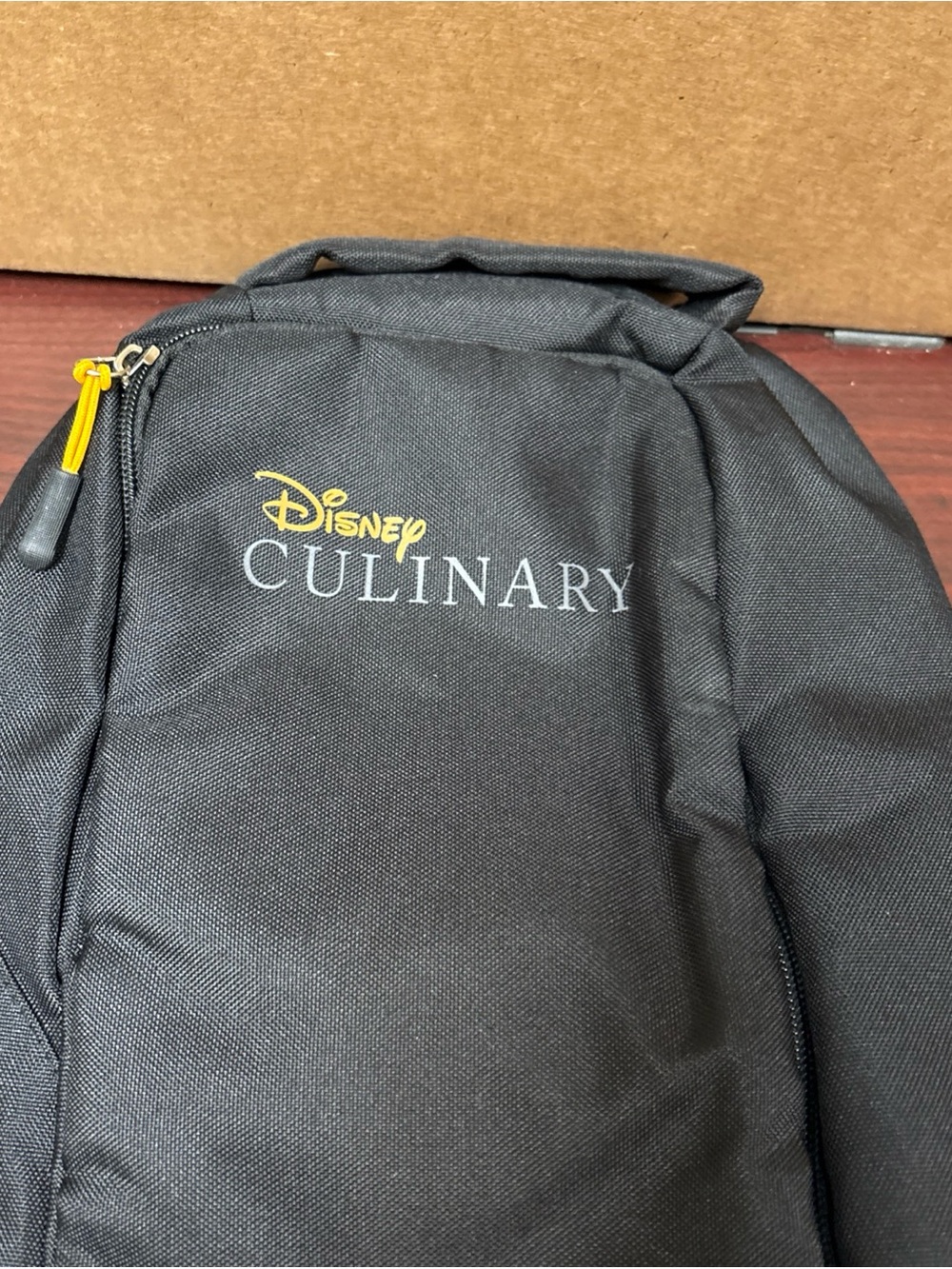 Disney Culinary Cast Member Black Orange Sling Bag Backpack Shoulder Tote New - Picture 2 of 7